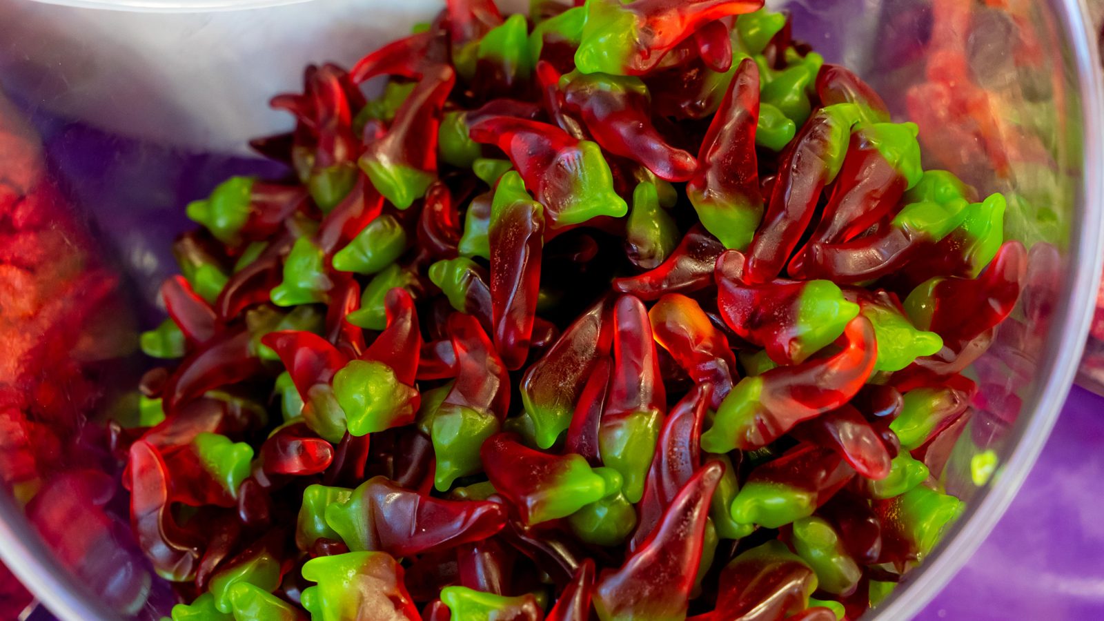 Chili-dusted gummy chamoy candy in a bulk bin